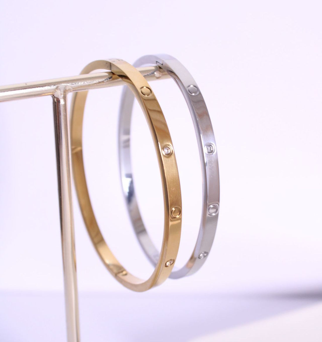 Pulseras rígidas de acero inoxidable de Hétika en dorado y plateado
